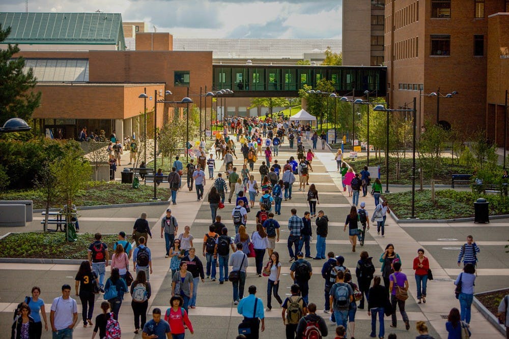 <p>Students walk down the Academic Spine on UB's North Campus. UB is ranked No. 99 for national schools and No. 45 for public schools in U.S. News and World Report’s annual National Universities and Public Universities rankings.</p>
