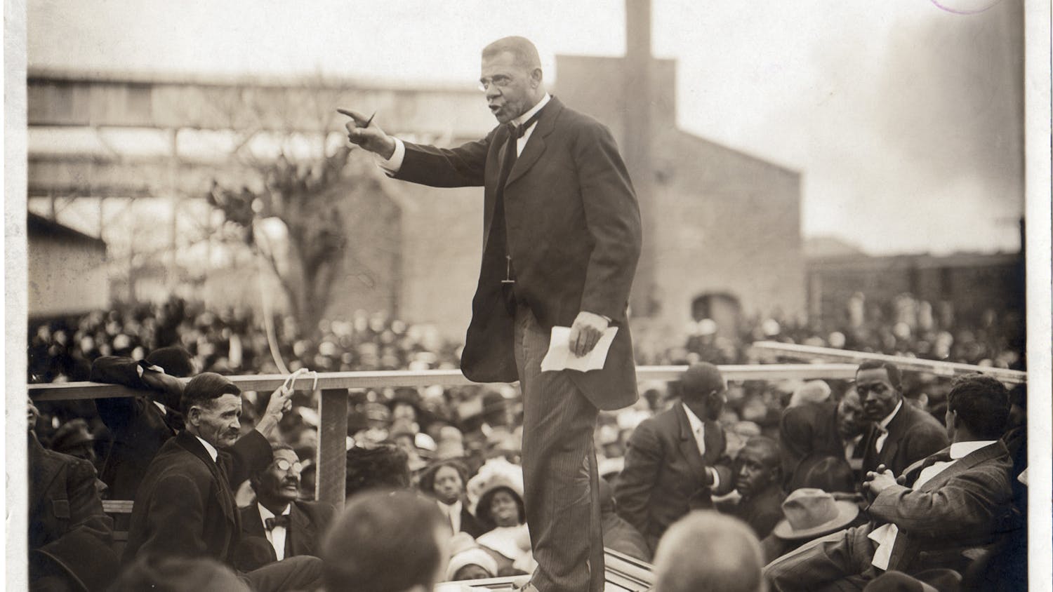 American educator, economist, and industrialist Booker T Washington (1856 - 1915), speaks to a large crowd during his last pilgrimage in Louisiana, during one of his southern educational tours, circa 1915. Washington founded the Tuskegee Institute in Alabama. (Photo by Arthur P. Bedou/Robert Abbott Sengstacke/Getty Images)