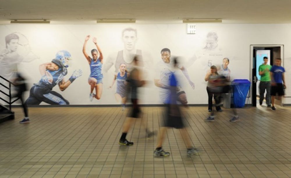 UB Athletics completed the first part of its redesign initiative - a graphic design that stretches throughout the arena. It features a variety of UB athletes wearing their respective blue and white jerseys. An interactive Hall of Fame will be completed by the beginning of next semester.
Yusong Shi, The Spectrum.&nbsp;