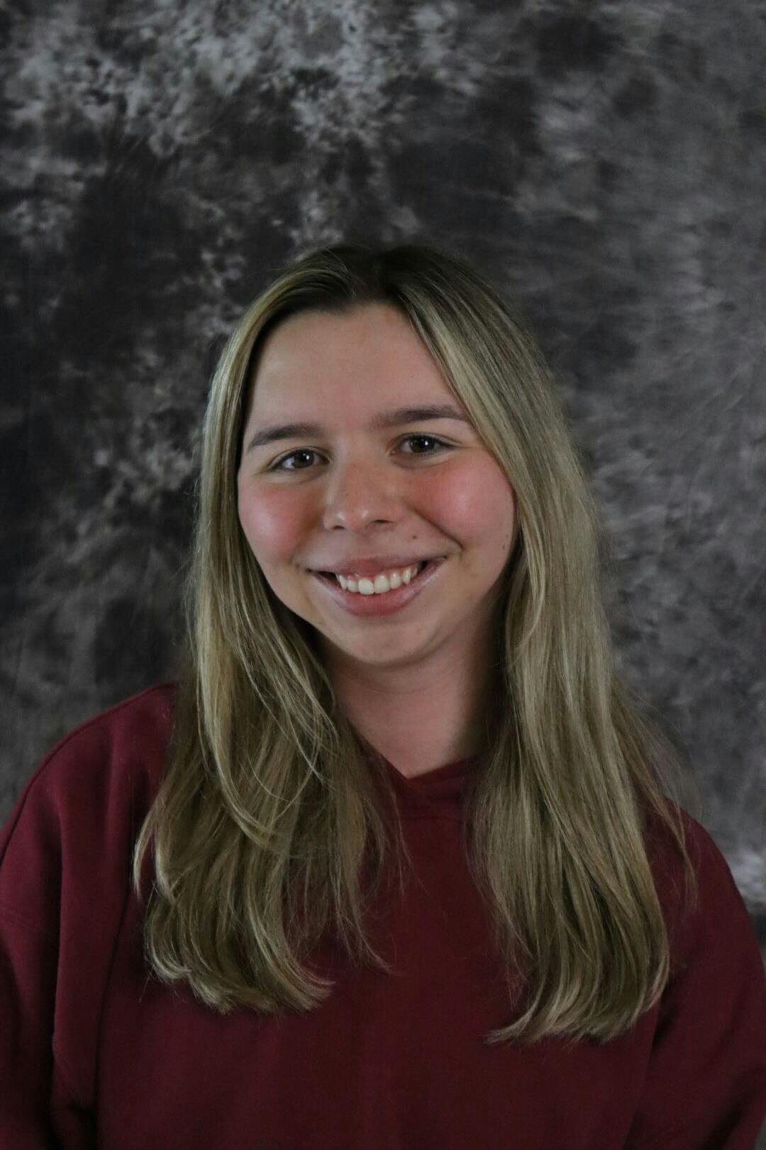 A headshot of staff writer Emma Schneeberger