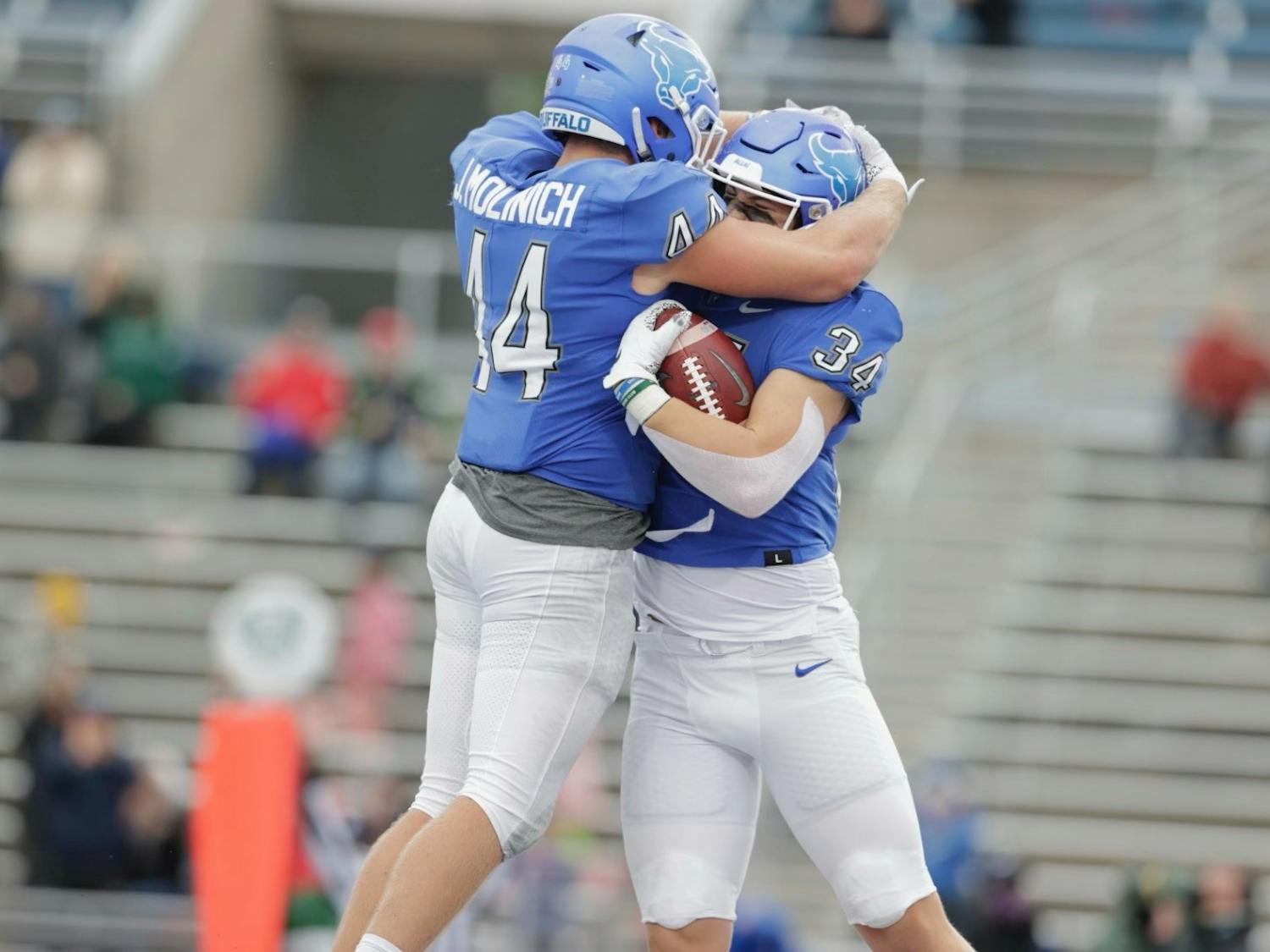 Sophomore tight end Trevor Borland (34) celebrates with redshirt fifth-year tight end Jake Molinich (44) following a touchdown Saturday.