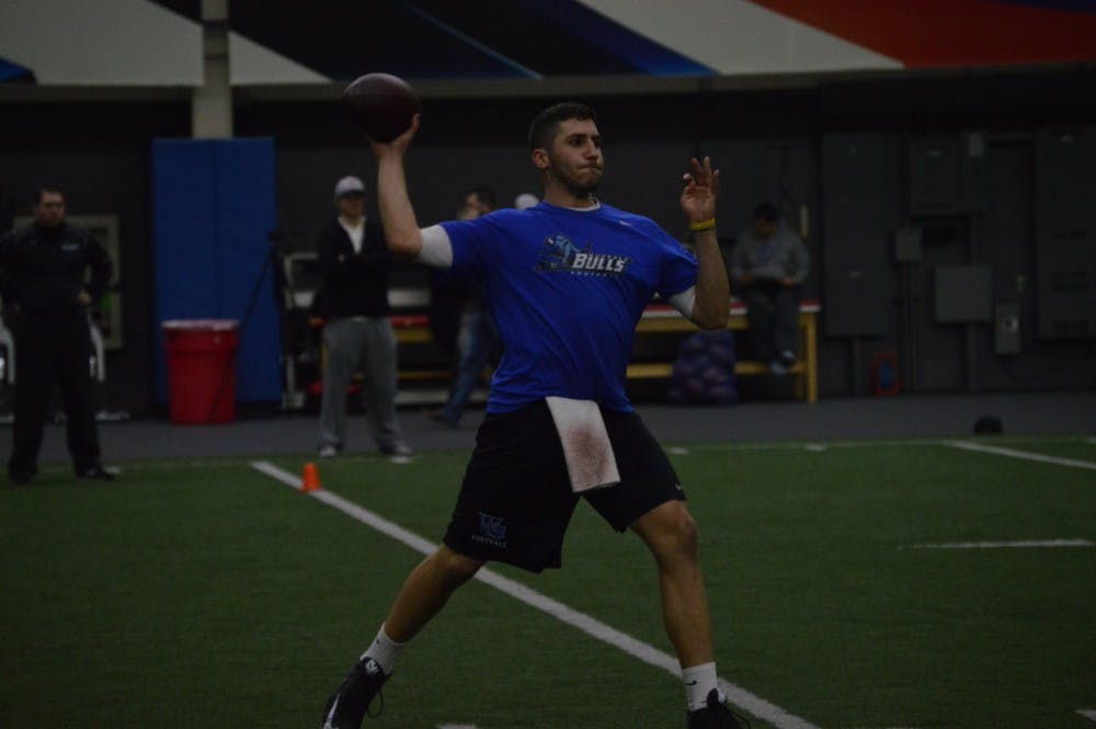 <p>Former Buffalo quarterback Joe Licata throws a pass during his workout at UB's Pro Day on Wednesday. Licata and 11 of his former Bulls teammates&nbsp;tried to prove their worth to professional scouts.&nbsp;</p>
