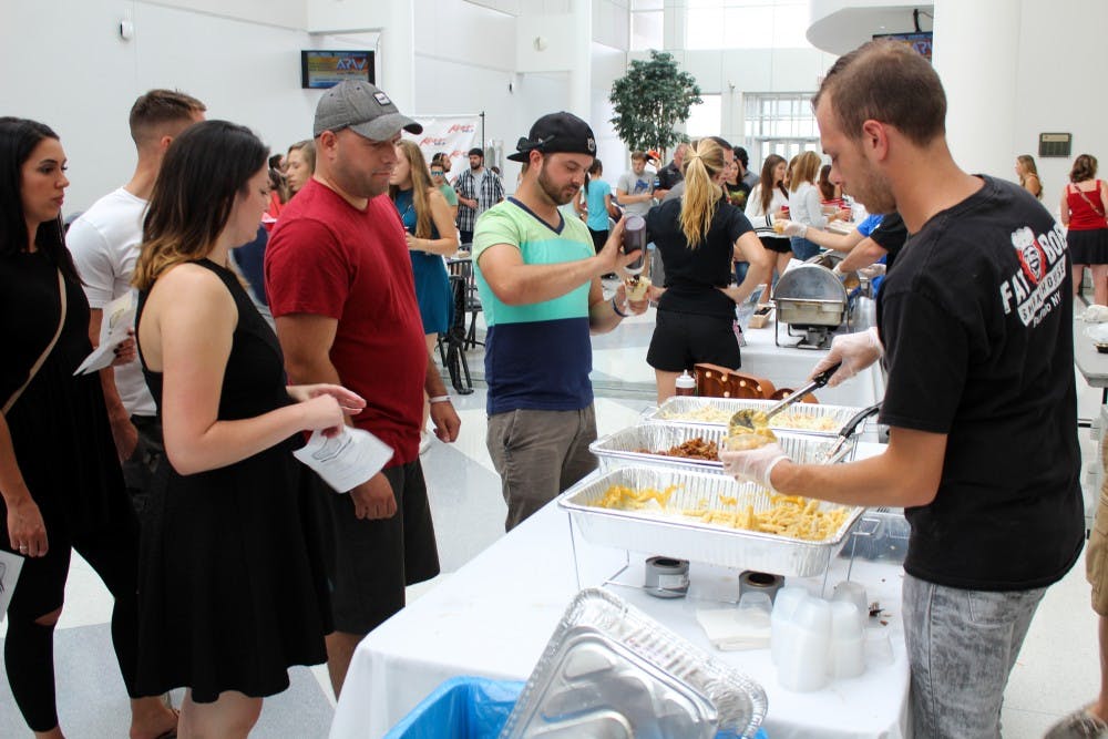 <p>There were 11 competitors in the "Mac Attack" competition, including Mooney’s, The Press Box and Protocol Restaurant. The event was held in CFA seating area, with vendors lining the walls serving small cups of mac and cheese to attendees.</p>