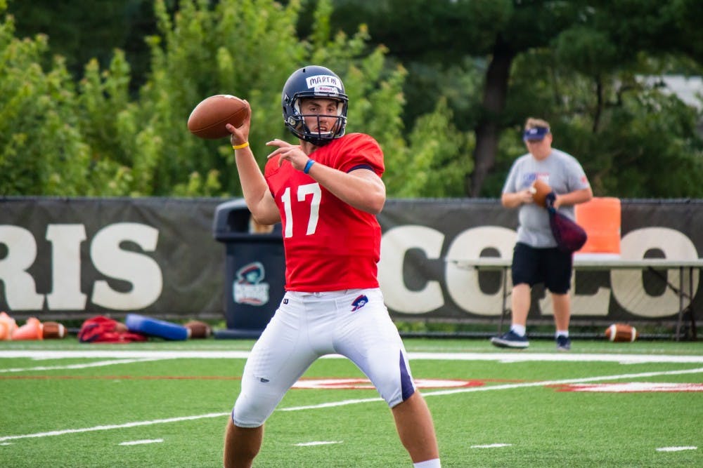 <p>QB George Martin winds up for a pass during the Colonials’ training camp in 2017.</p>