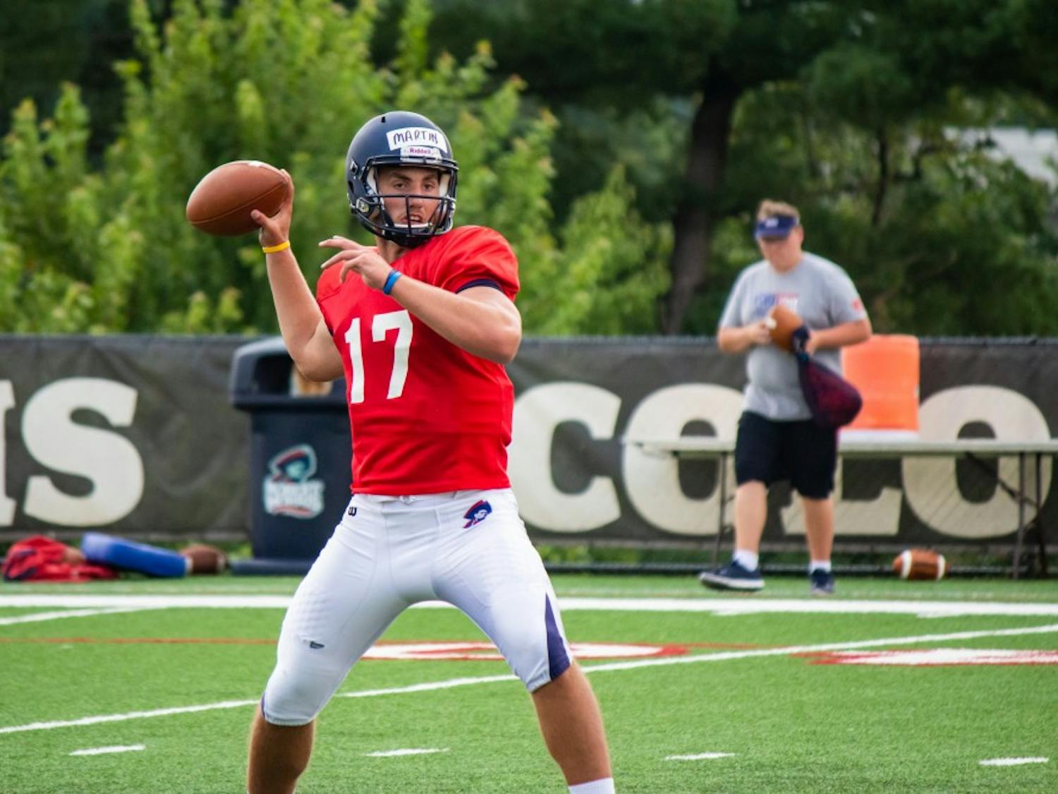 QB George Martin winds up for a pass during the Colonials’ training camp in 2017.