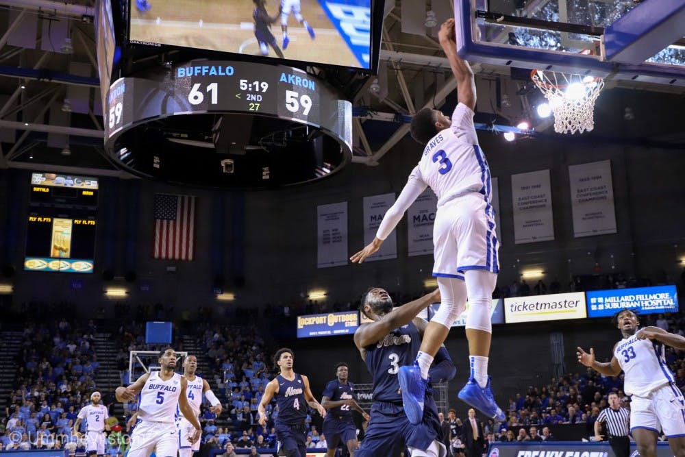 <p>Sophomore guard Jayvon Graves rises up for the slam dunk. His block on one end and slam on the other shifted the momentum during the final five minutes.</p>