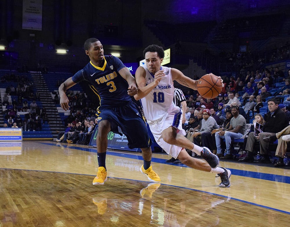 <p>Senior guard Jarryn Skeete drives to the basket in a 71-69 loss to Toledo in Alumni Arena on Feb. 9. Skeete and the Bulls head into Cleveland looking to repeat as MAC champions.&nbsp;</p>