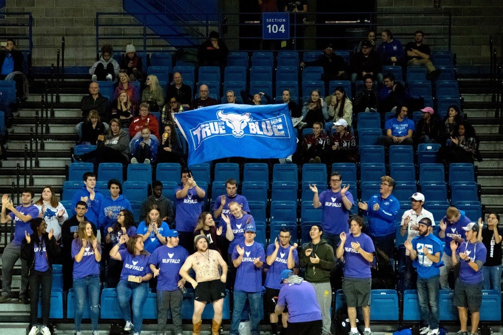 <p>UB Naked Guy standing with True Blue at a game. He has become a common fixture at UB games often sitting with True Blue.</p>