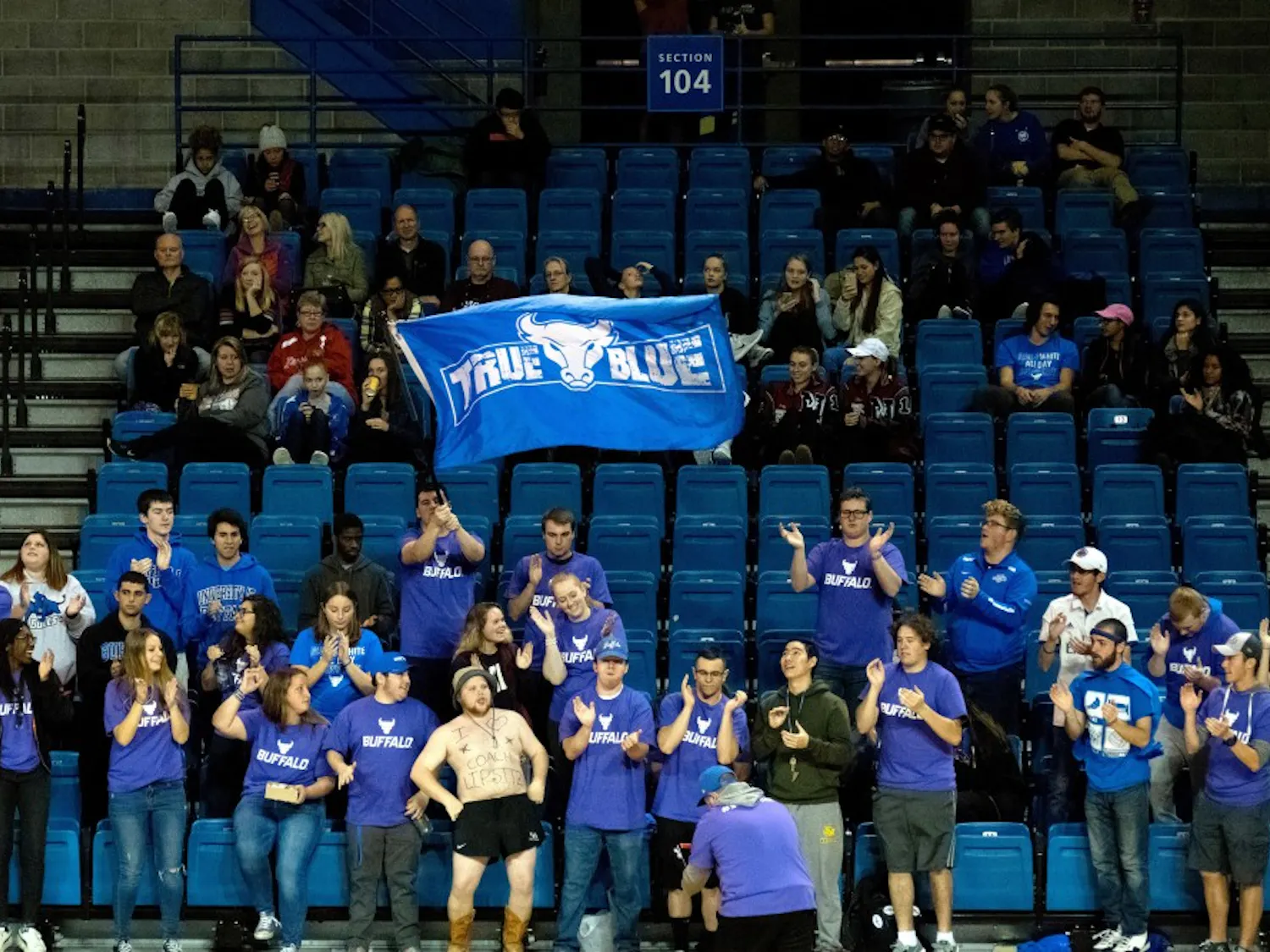 UB Naked Guy standing with True Blue at a game. He has become a common fixture at UB games often sitting with True Blue.
