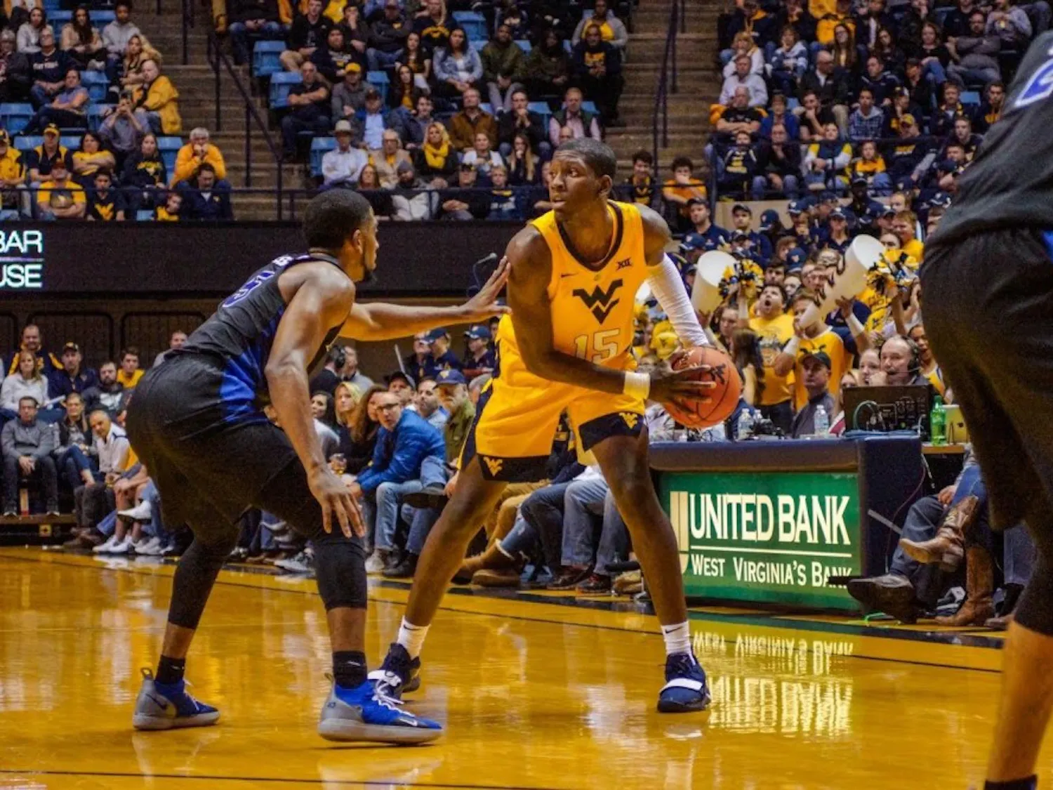 Senior guard CJ Massinburg defends West Virginia’s Lamont West. Massinburg finished with a career-high 43 points and 9 three-pointers. 
