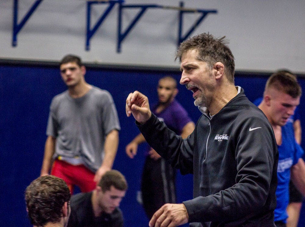 <p>Head coach John Stutzman talks to his team. Stutzman hopes UB wrestling can take a major jump this season.</p>