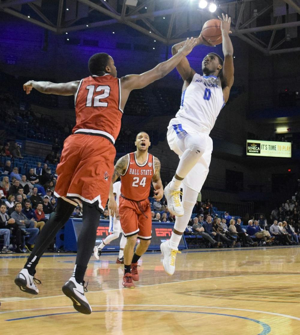 <p>Junior wing&nbsp;Blake Hamilton takes a contested shot in the lane against Ball State.&nbsp;</p>