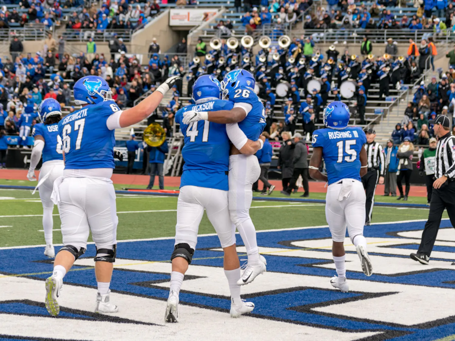 Junior quarterback Tyree Jackson celebrates with freshman running back Jaret Patterson after scoring in a game earlier this season. The Bulls broke the school record in rushing touchdowns this season with 32.