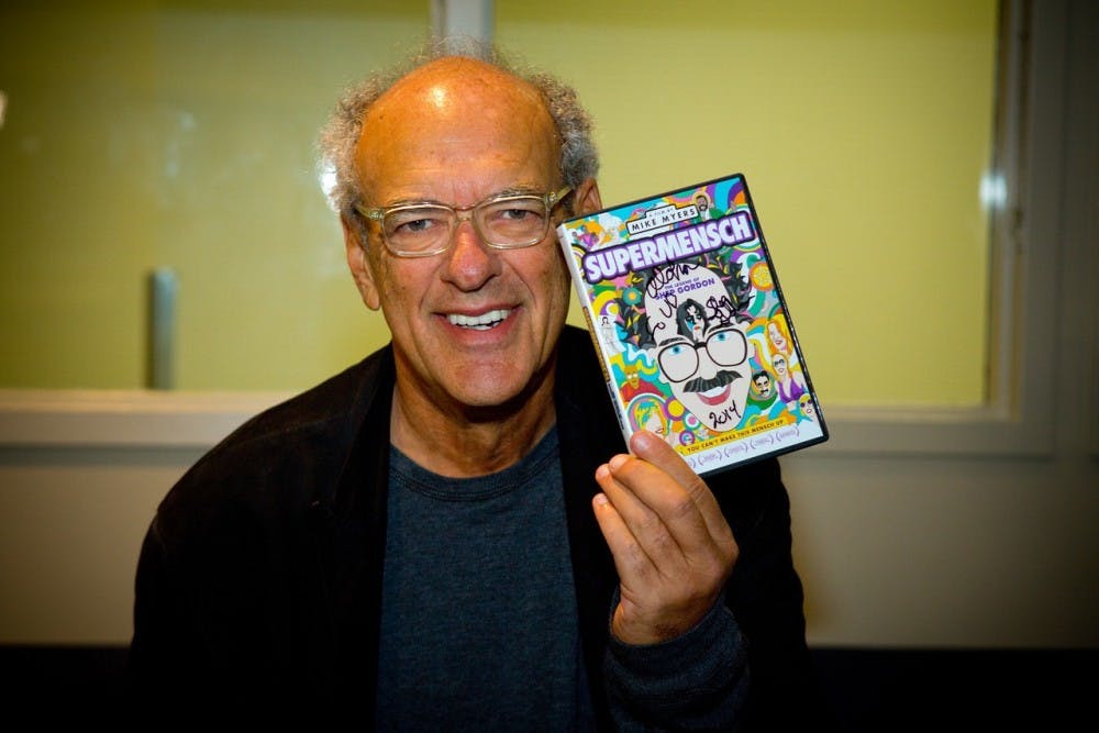 <p>Retired music mogul Shep Gordon holds a copy of his documentary, which Mike Myers made about his life. Gordon often refers to his time at UB as some of the greatest years of his life.</p>