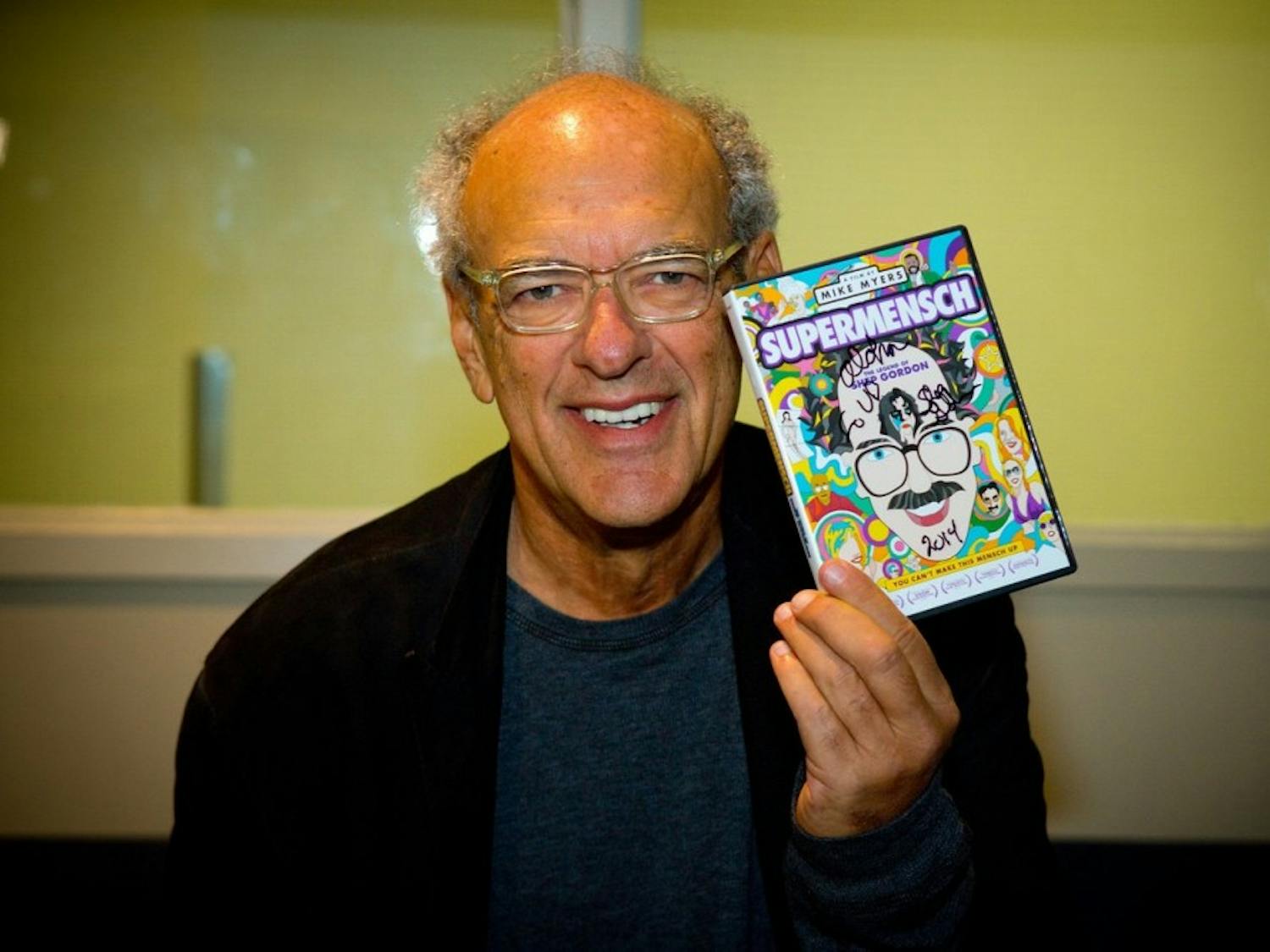 Retired music mogul Shep Gordon holds a copy of his documentary, which Mike Myers made about his life. Gordon often refers to his time at UB as some of the greatest years of his life.