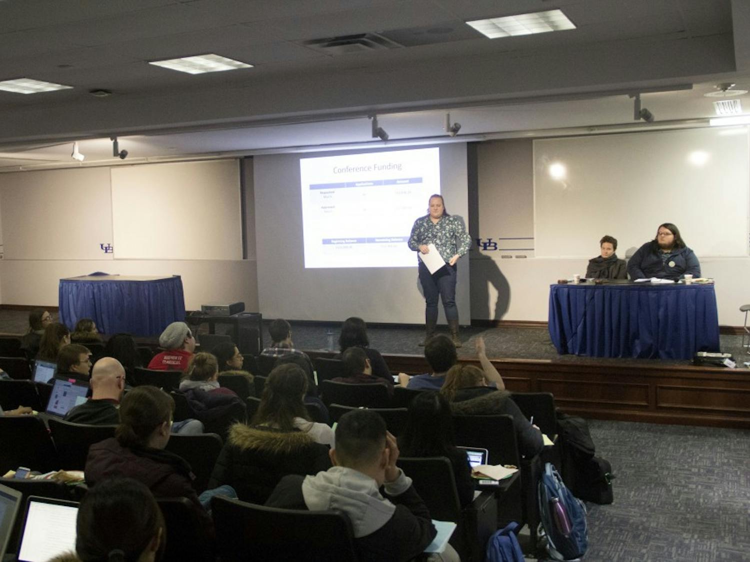 Jennifer Schechter presenting the report of the treasurer at the GSA meeting on Wednesday. Schechter (left) is pictured next to GSA President Tanja Aho (center) and Vice President Connor Walters (right).