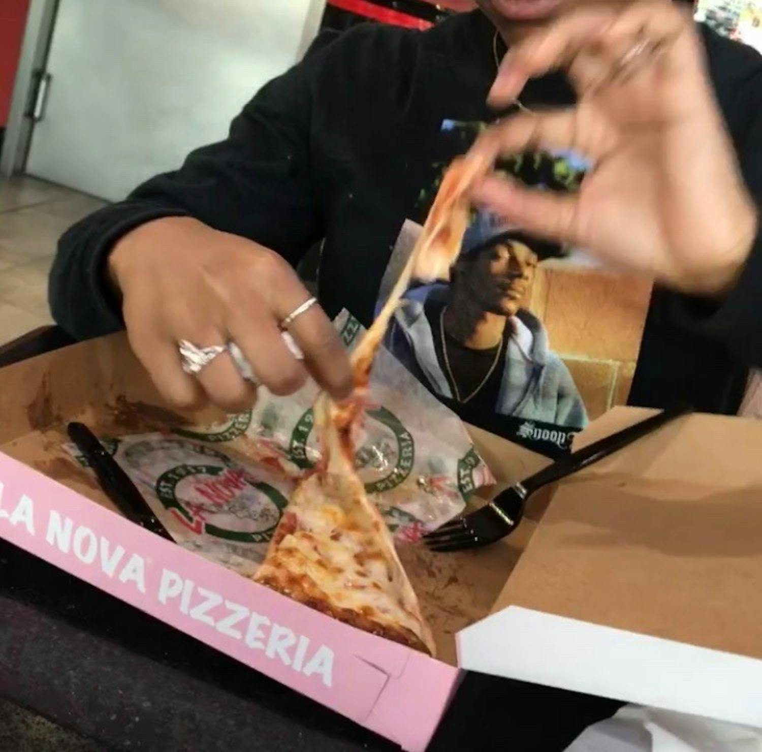 La Nova's plain cheese pizza inside of their aesthetically pleasing pink box.