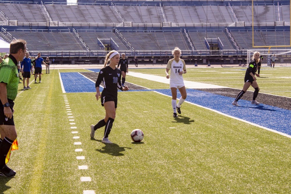 <p>Senior Kara Daly looks to pass during game on Sunday.</p>