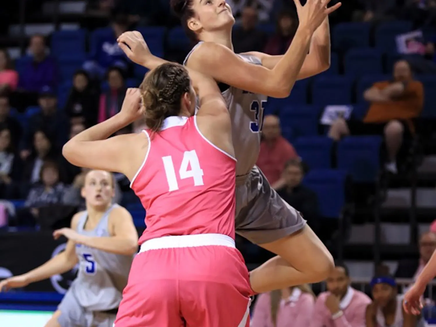 Senior center Cassie Oursler pushes in the paint to make a layup. Oursler has been one of the Bulls' top players all season.