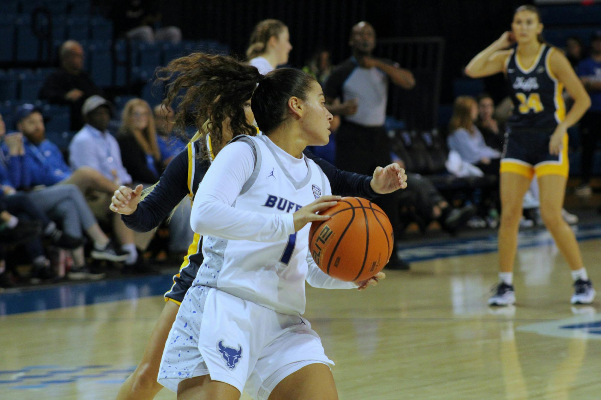 Senior guard Rana Elhusseini, pictured above at the Bulls' opening game, racked up 11 points during Saturday's game, putting her just behind freshman guard Kirsten Lewis-Williams, who scored 13.&nbsp;