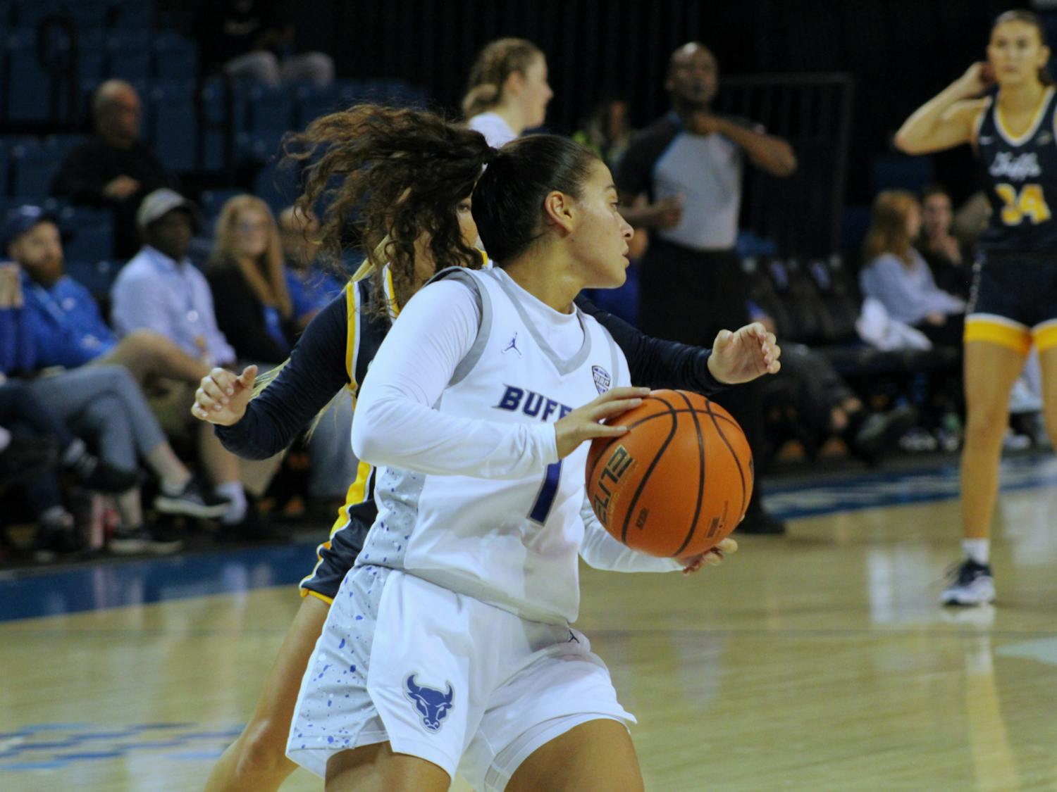 Senior guard Rana Elhusseini, pictured above at the Bulls' opening game, racked up 11 points during Saturday's game, putting her just behind freshman guard Kirsten Lewis-Williams, who scored 13.&nbsp;