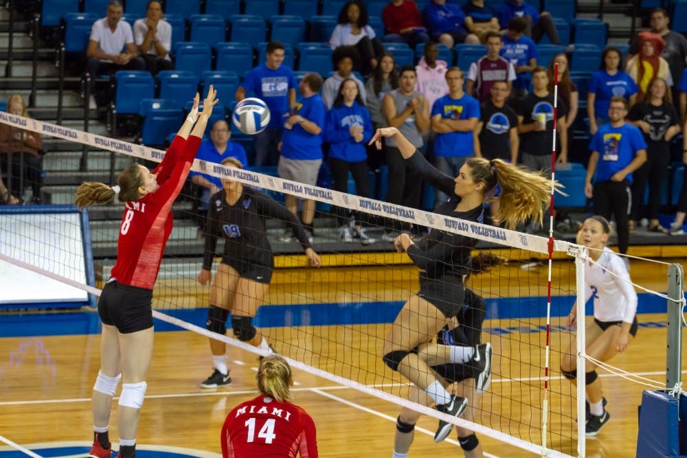 <p>Senior midblocker Megan Wernette looks for the spike in a game at home. The Bulls beat the Bowling Green Falcons Saturday.</p>