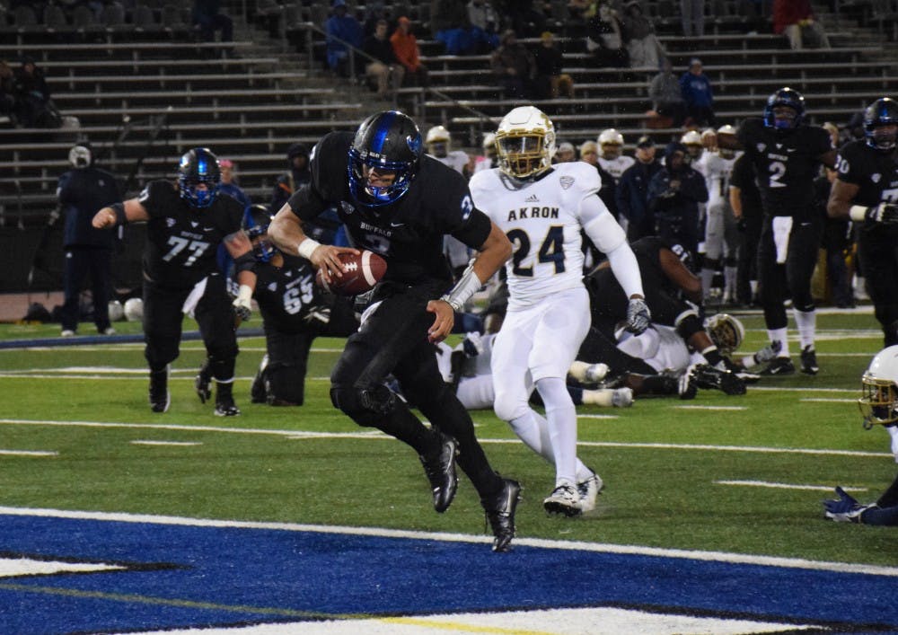 <p>Freshman quarterback Tyree Jackson scores a touchdown. Thursday night's victory over Akron&nbsp;was the Bulls' first conference&nbsp;win.&nbsp;</p>