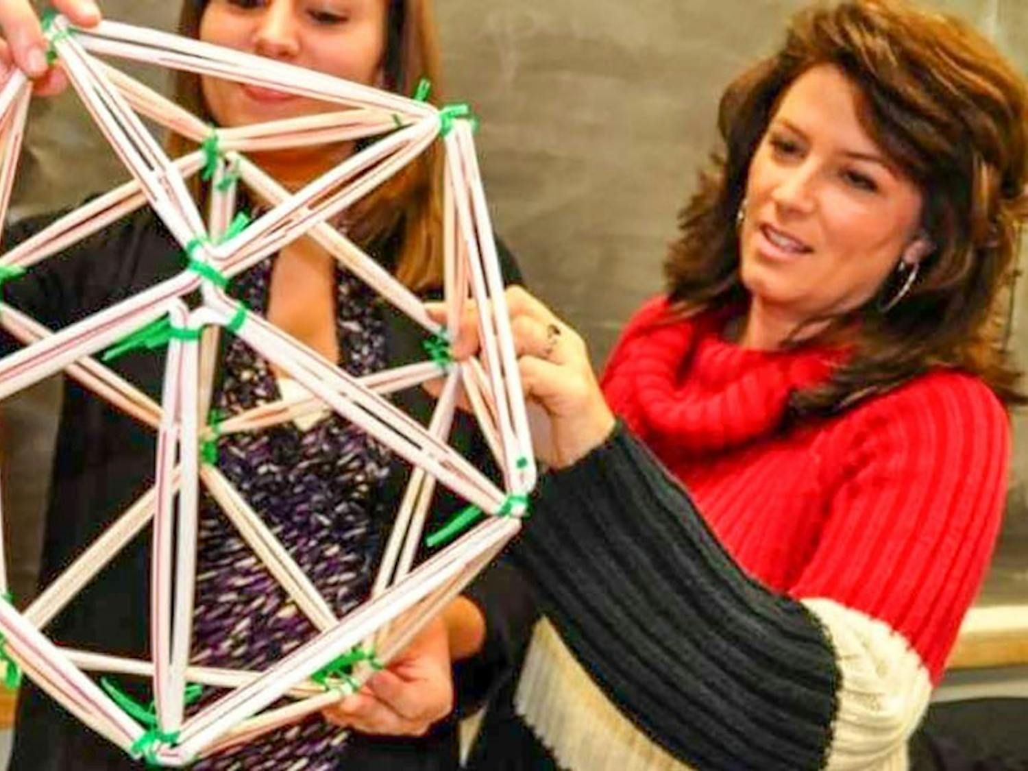 Professor Moore-Russo instructs a student. She uses her loves of games to teach math to her students in a unique way. 