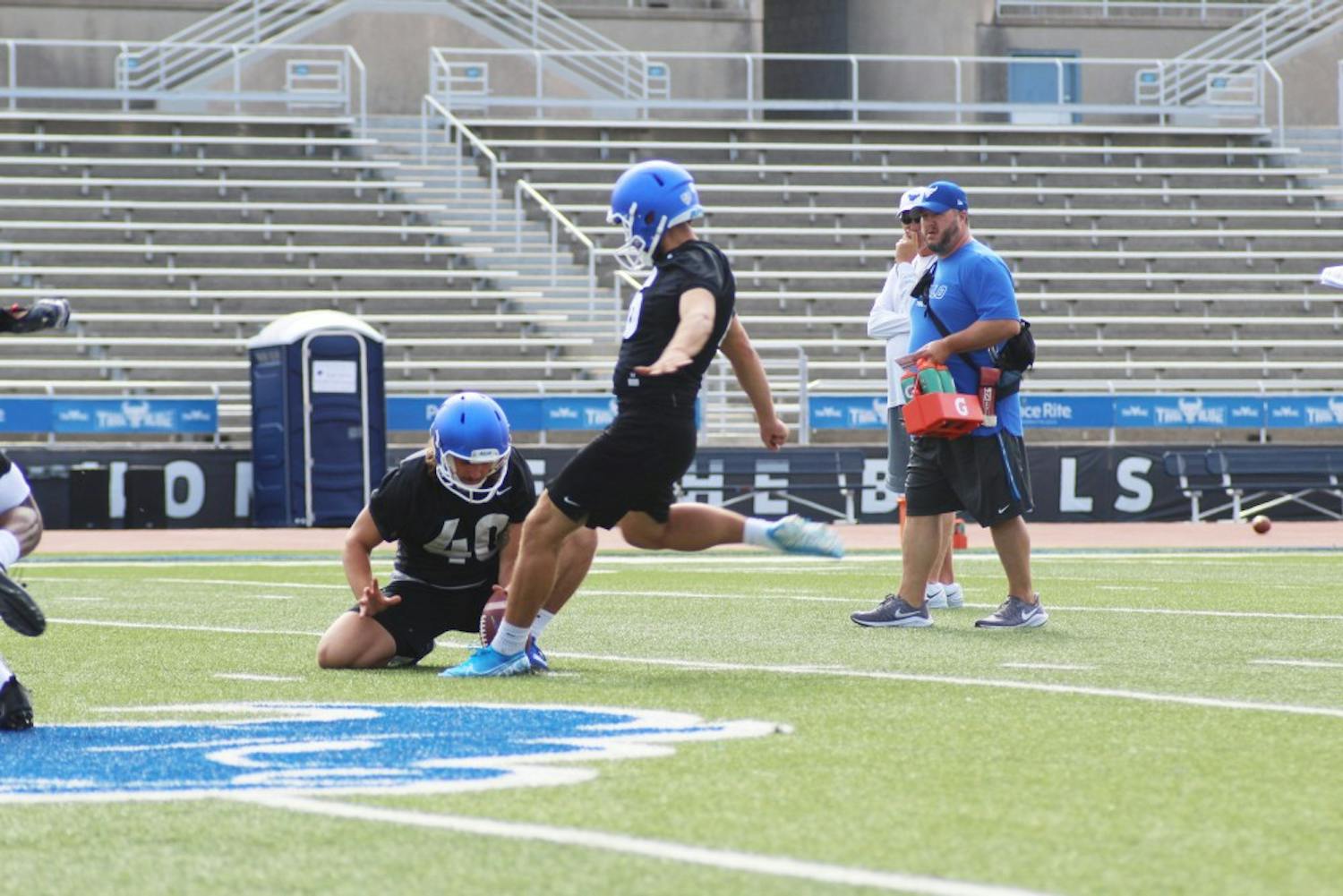 UB kicker Alex McNulty levels his foot against the ball at a summer football practice.