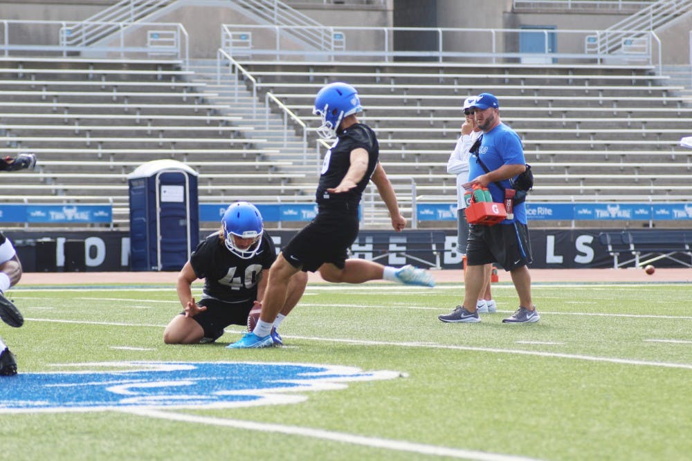 <p>UB kicker Alex McNulty levels his foot against the ball at a summer football practice.</p>