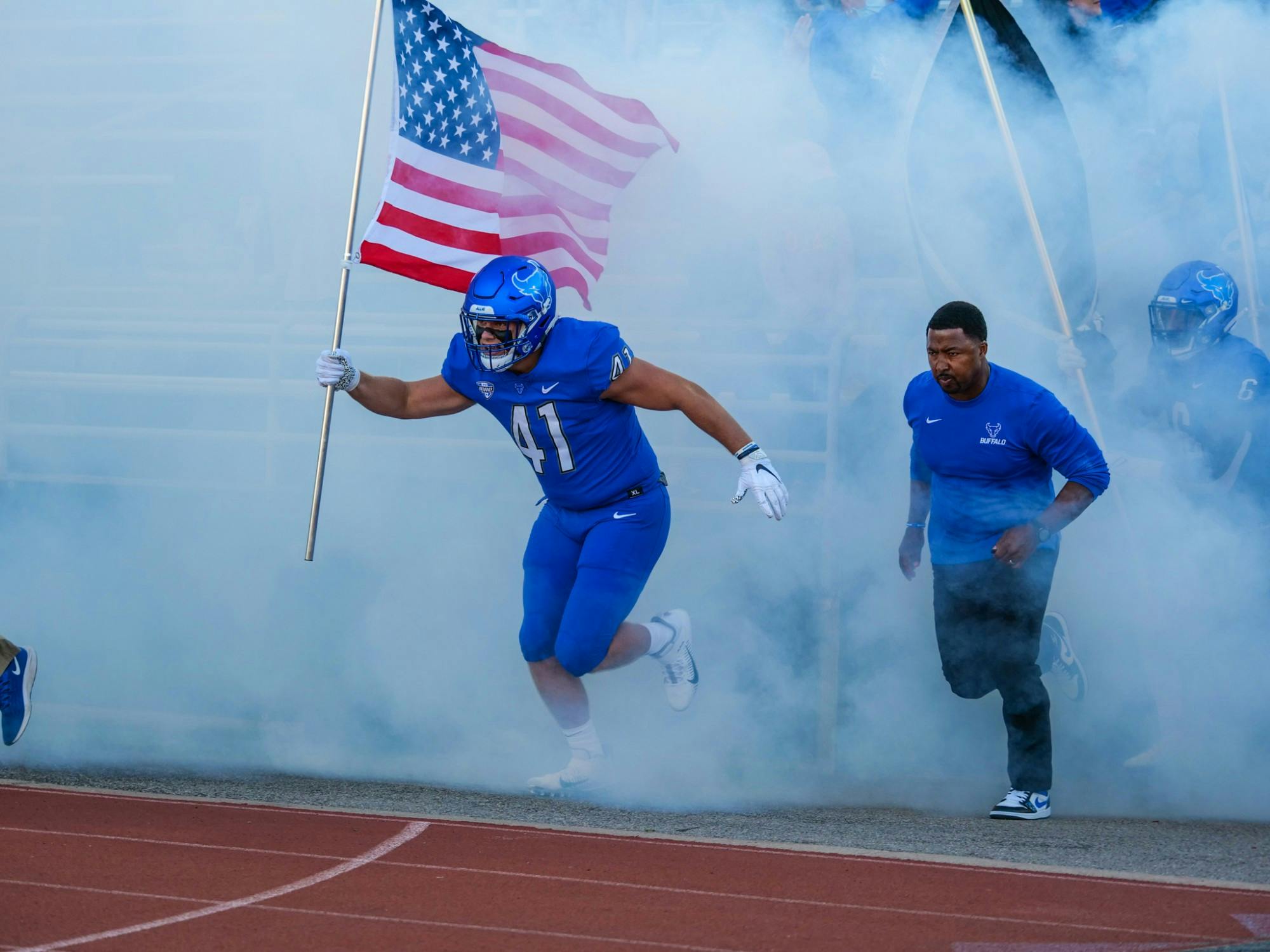 Tight end Jake Molinich (41) leads the Bulls out of the tunnel ahead of their 2021 home opener.