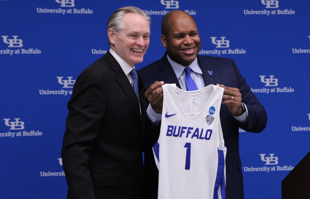 <p>New men’s basketball coach Jim Whitesell holds up a jersey with Athletic Director Mark Alnutt. Whitesell replaces Nate Oats as head coach after he left for Alabama.</p>