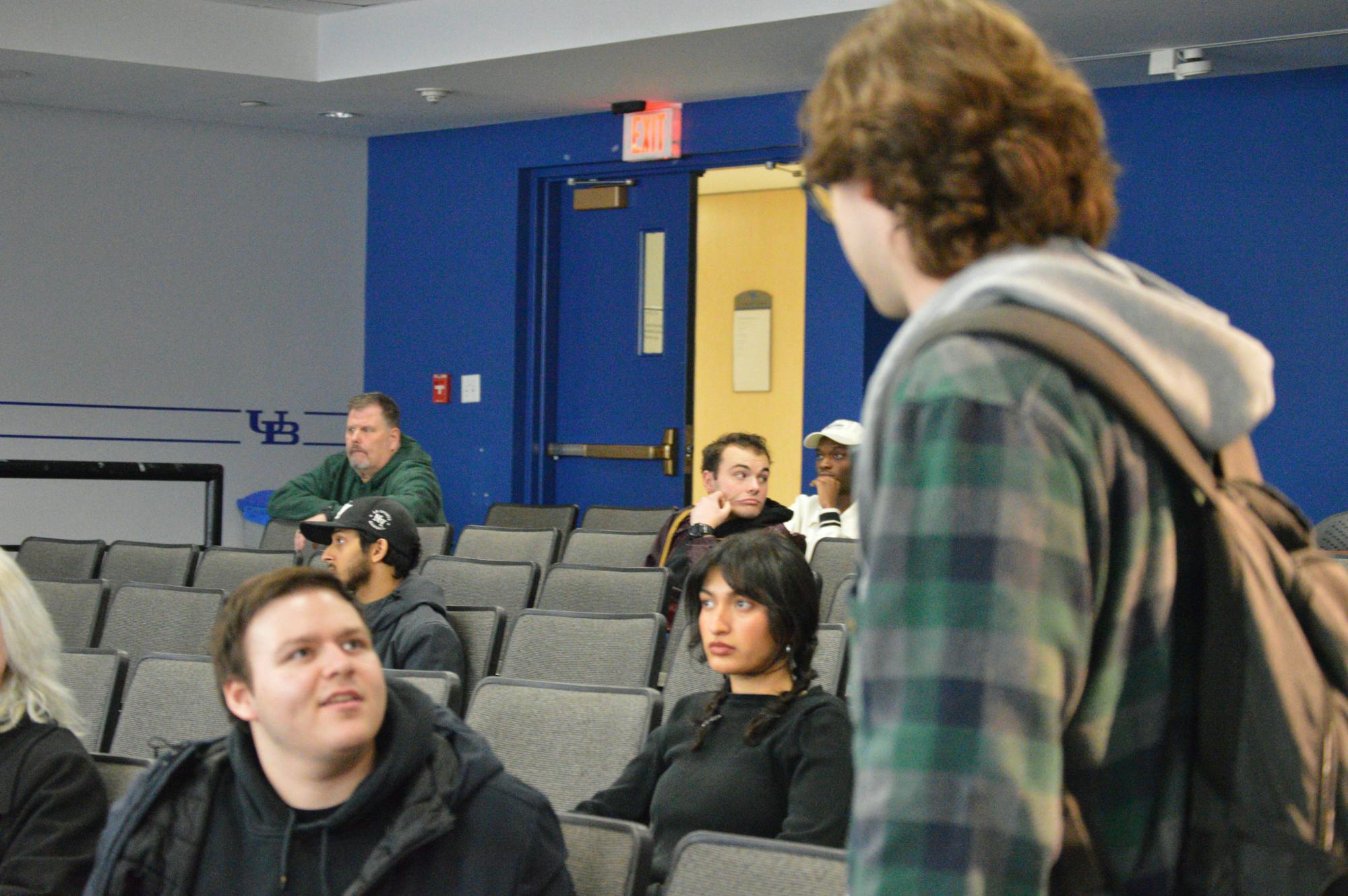 Arriving minutes after the majority of the SA Senate voted to deny his motion to leave the advocacy committee, SA Senator Grant Peterson (right) is informed by fellow Senator Joshua Brodsky (left) of the result.