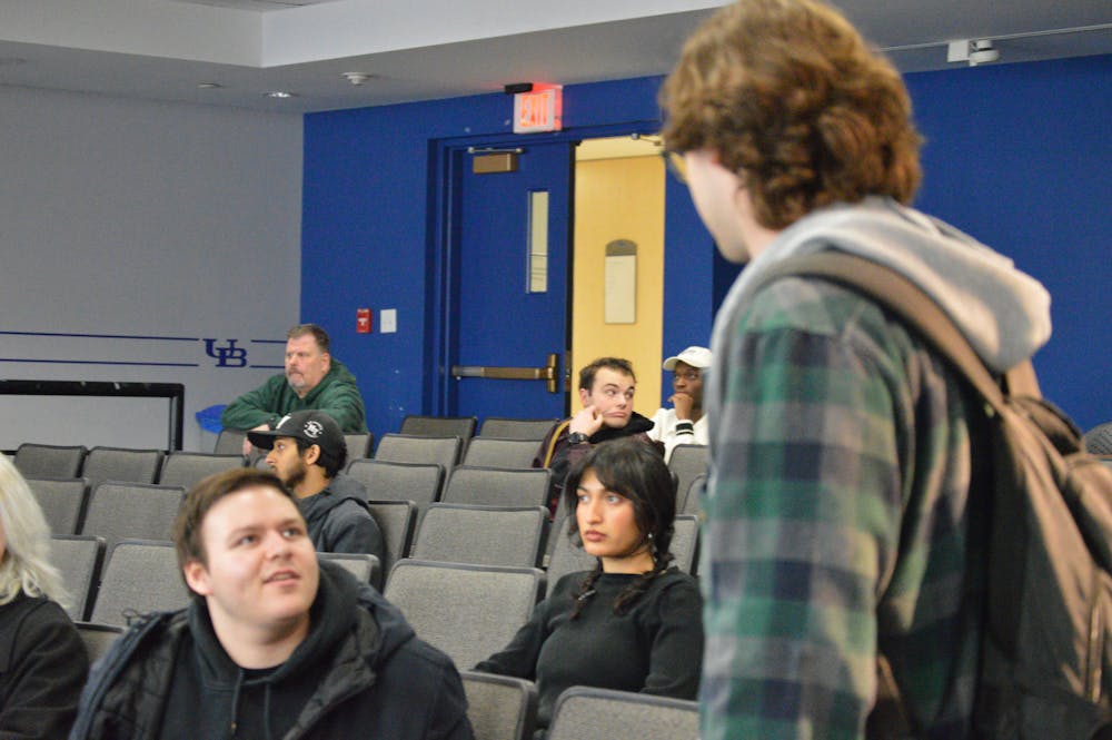 Arriving minutes after the majority of the SA Senate voted to deny his motion to leave the advocacy committee, SA Senator Grant Peterson (right) is informed by fellow Senator Joshua Brodsky (left) of the result.