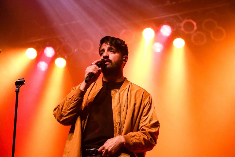 <p>Sameer Gadhia, lead singer of Young the Giant, performs at the Center for the Arts Saturday.</p>