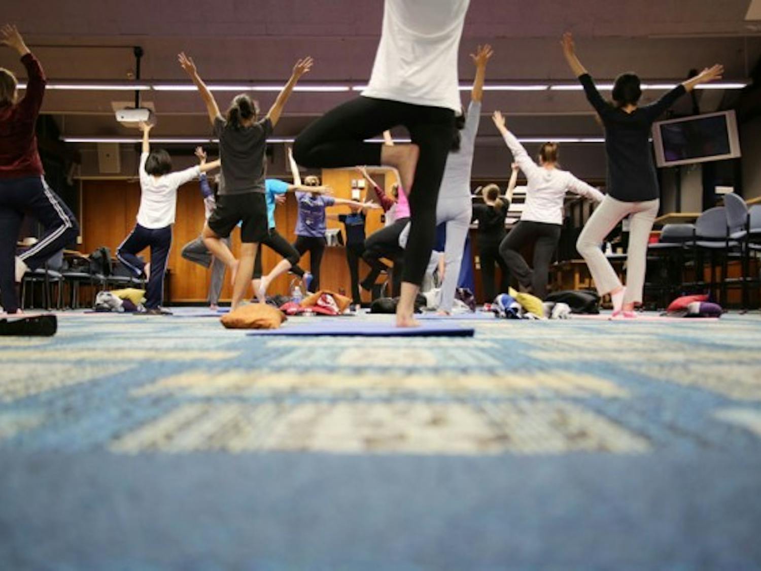 Students in Ulrike Carlino-Macdonald&rsquo;s Gentle Hatha Yoga class stretch, breathe and focus their way to relaxation and health every Wednesday at 5 p.m. on the 10th floor of Goodyear Hall on South Campus. The class is run by UB Wellness and Education Services.&nbsp;Harutyun Khachatryan, The Spectrum 