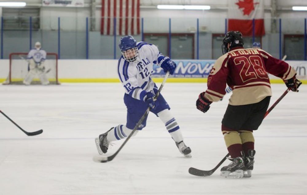 Junior forward Eric Nestler fires a shot from inside the blue line. The Buffalo hockey team will look to rebound this season after being eliminated in the first round of playoffs last year. Chad Cooper, The Spectrum