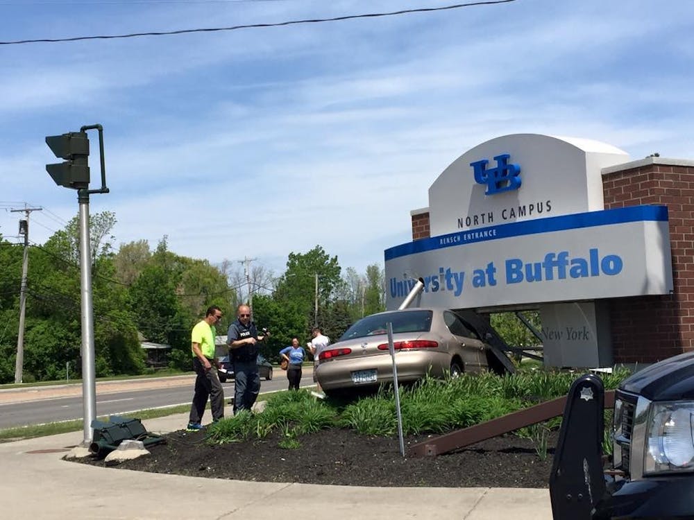 <p>A car took out a traffic signal and crashed into the Rensch entrance sign on UB's North Campus on Sunday afternoon. No injuries occurred. </p>