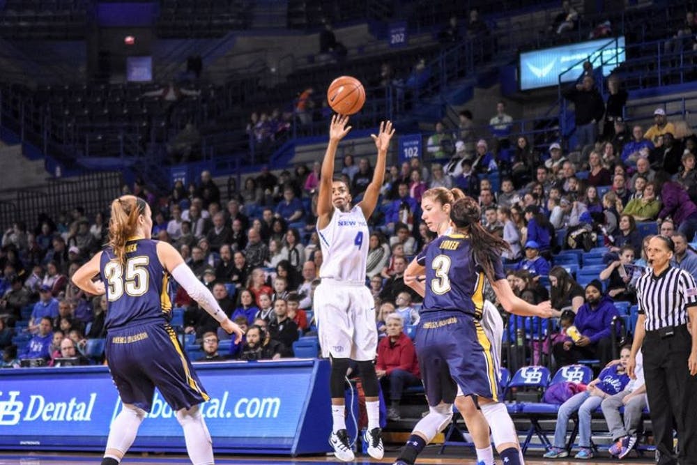 <p>Junior guard Joanna Smith lets off a shot during Buffalo's victory over Kent State in Alumni Arena on March 5.&nbsp;</p>