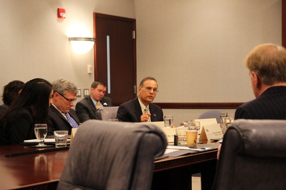 <p>President Satish Tripathi (center), Provost Charles Zukoski (left) and UB Council Student Representative Minahil Khan (far left) at the UB Council meeting Monday in Capen Hall. The Council discussed rational tuition, as well as renovations to UB’s three campuses.</p>