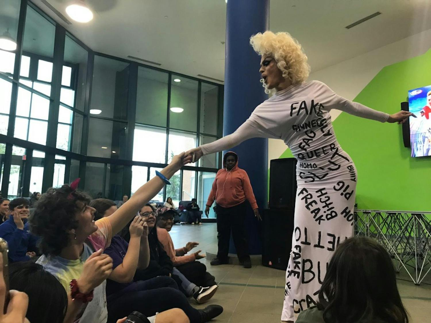 Drag queen Alice Raige answered questions from students during the Q&amp;A portion of the drag show.