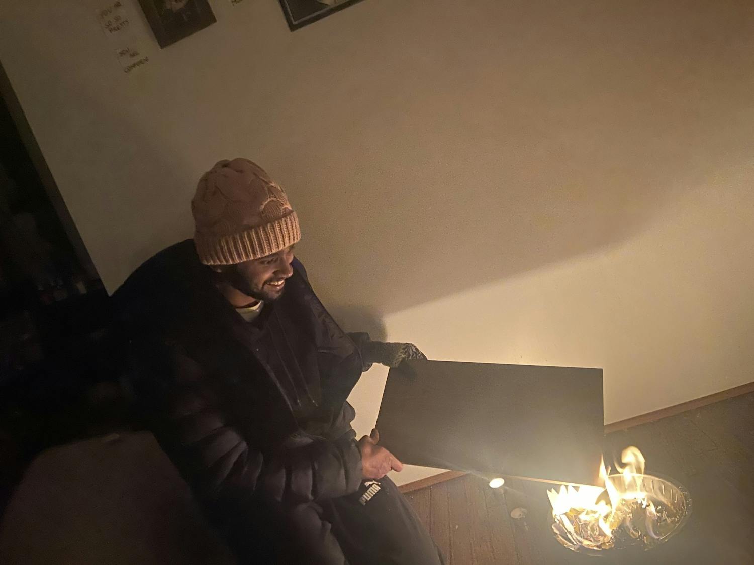 Karthik Ramkumar had to resort to burning a book to stay warm during Winter Storm Elliot.