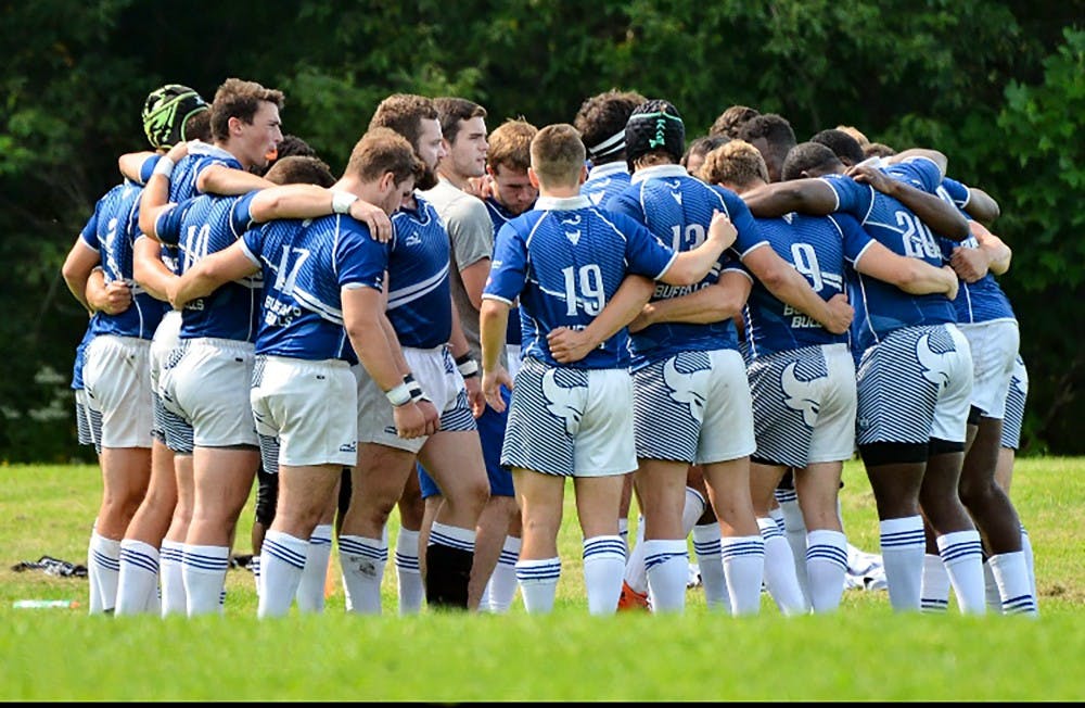 <p>The men's rugby team comes together before the start of their game. The Bulls look to keep improving and establish themselves as a premier team in the country.</p>
