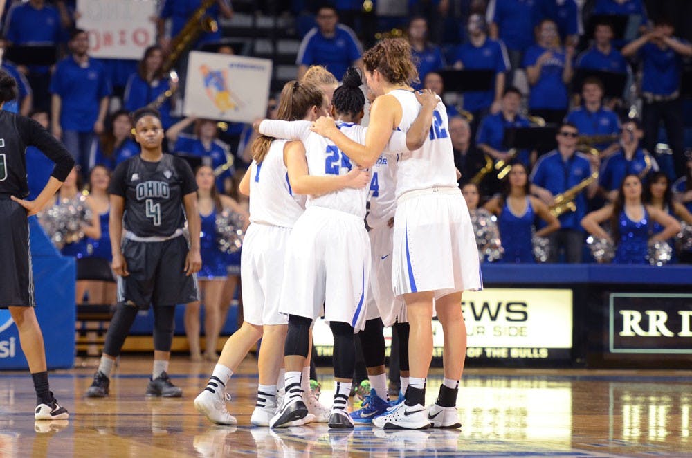 <p>The women's basketball team huddles during a 51-43 upset victory over Ohio on Feb. 3.&nbsp;</p>