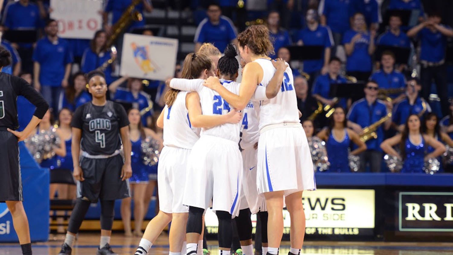 The women's basketball team huddles during a 51-43 upset victory over Ohio on Feb. 3.&nbsp;