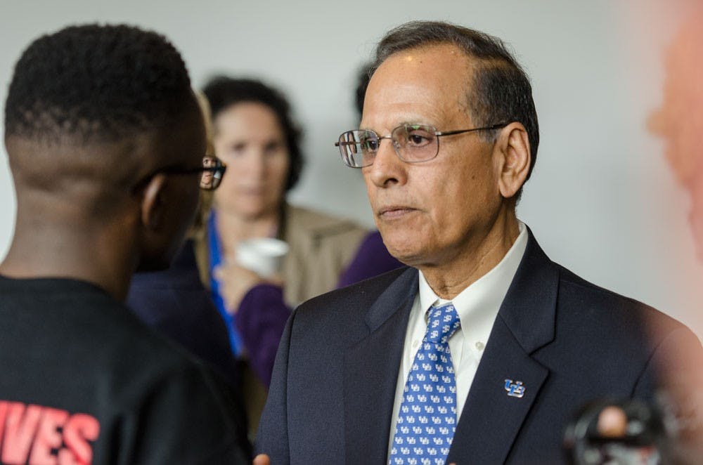 <p>President Satish Tripathi speaks with BSU President Micah Oliver after his State of the University Address. </p>