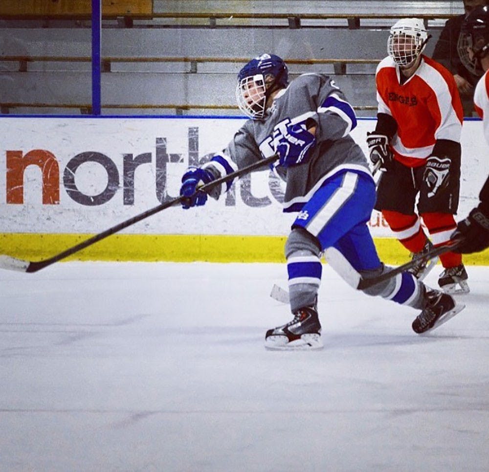 <p>Senior hockey player Gabe Kirsch takes a shot. Kirsch plays for the UB hockey club team despite being diagnosed with type-1 diabetes.</p>