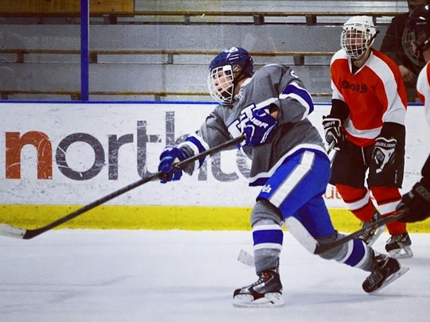 Senior hockey player Gabe Kirsch takes a shot. Kirsch plays for the UB hockey club team despite being diagnosed with type-1 diabetes.