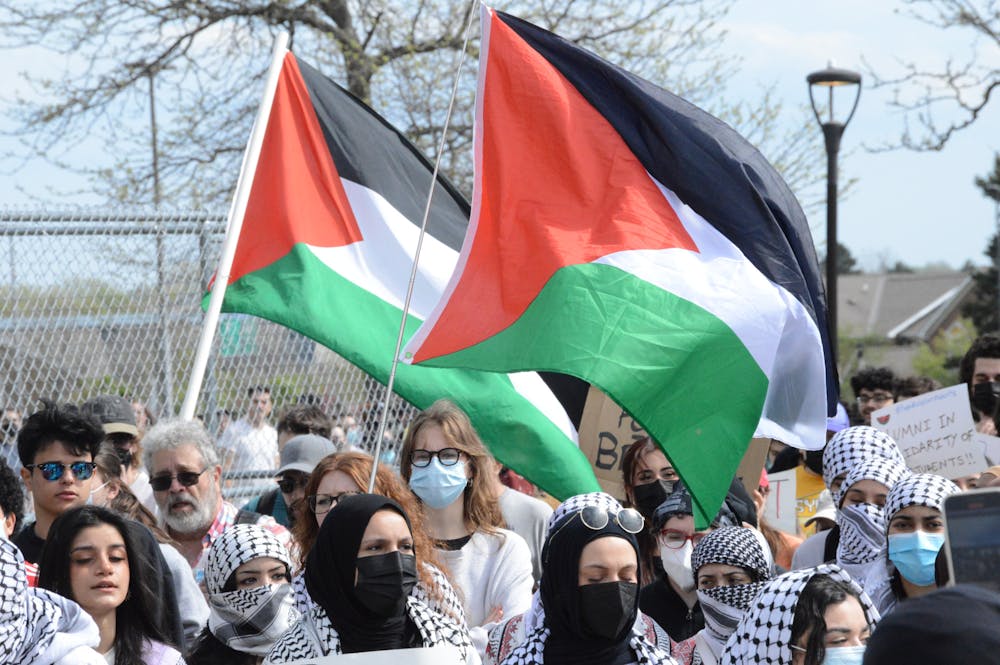 <p>Protestors carried Palestinian flags at Friday's on-campus demonstration.</p>