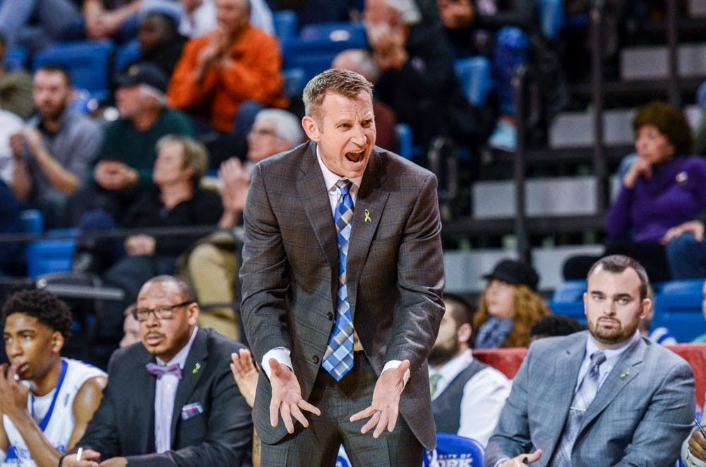 <p>Head coach Nate Oats disagrees with a call during the Bulls' 71-69 loss to Toledo at Alumni Arena on Feb. 9.&nbsp;</p>